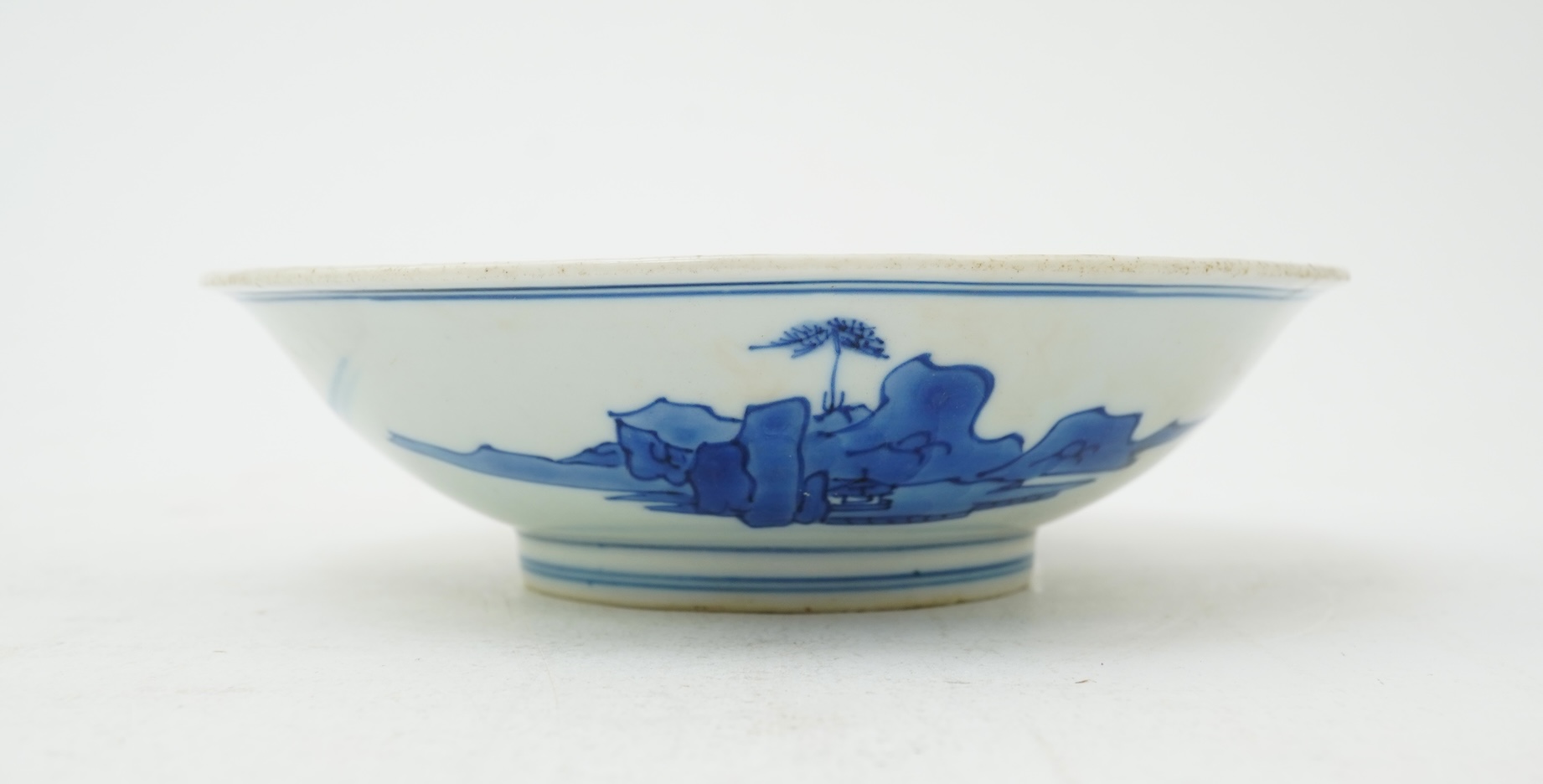 A Chinese blue and white saucer dish, Kangxi six character mark and of the period (1662-1722)